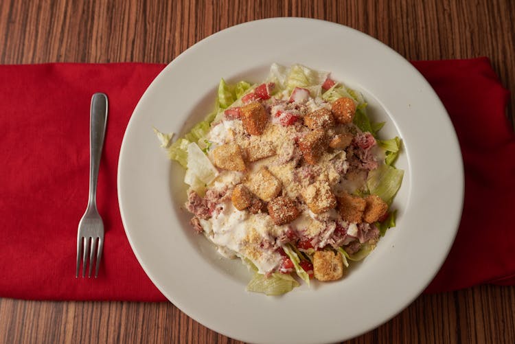 Caesar Salad On White Ceramic Plate 