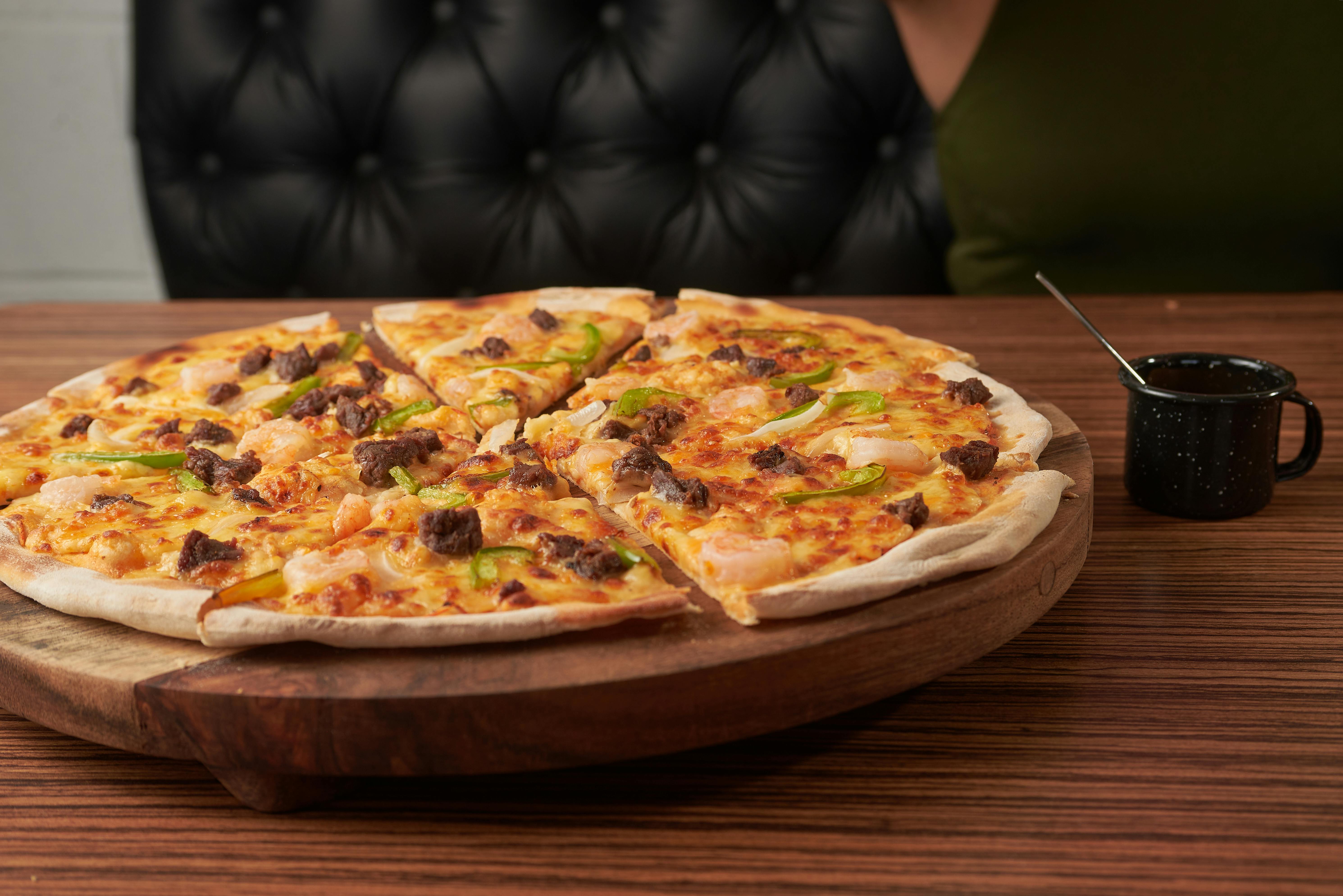 Buffalo Chicken pizza with blue cheese crumbles