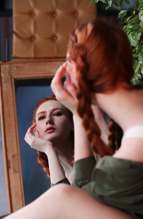 A Woman Posing at the Mirror