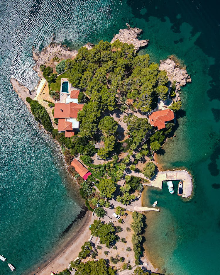 View Of Small Peninsula Surrounded By Turquoise Sea