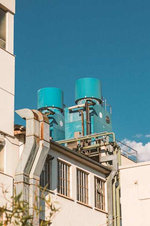 Foto d'estoc gratuïta de cel blau, edifici industrial, maquinària industrial