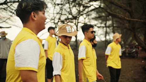 Free Men Wearing Yellow Shirts Stock Photo