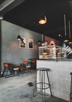 Explore the inviting ambiance of a modern coffee shop in Indonesia featuring stylish design and cozy seating.