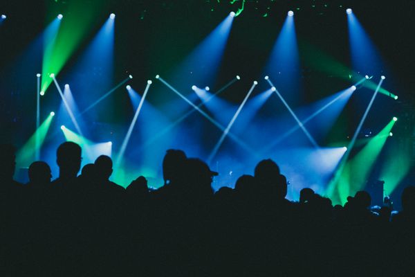 Laser lights across a dance floor — photo by Jonathan Cooper on Pexels