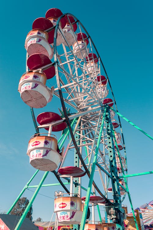 White and Red Ferris Wheel Under the Blue Sky