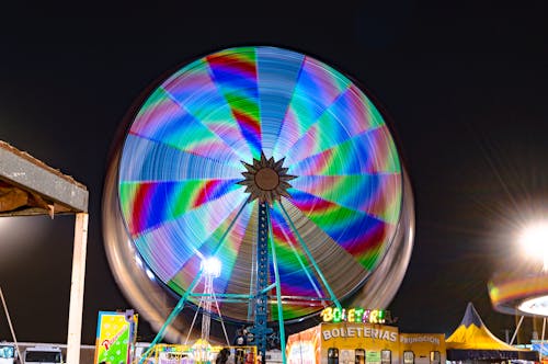 Time Lapse Photography of Ferris Wheel During Night Time