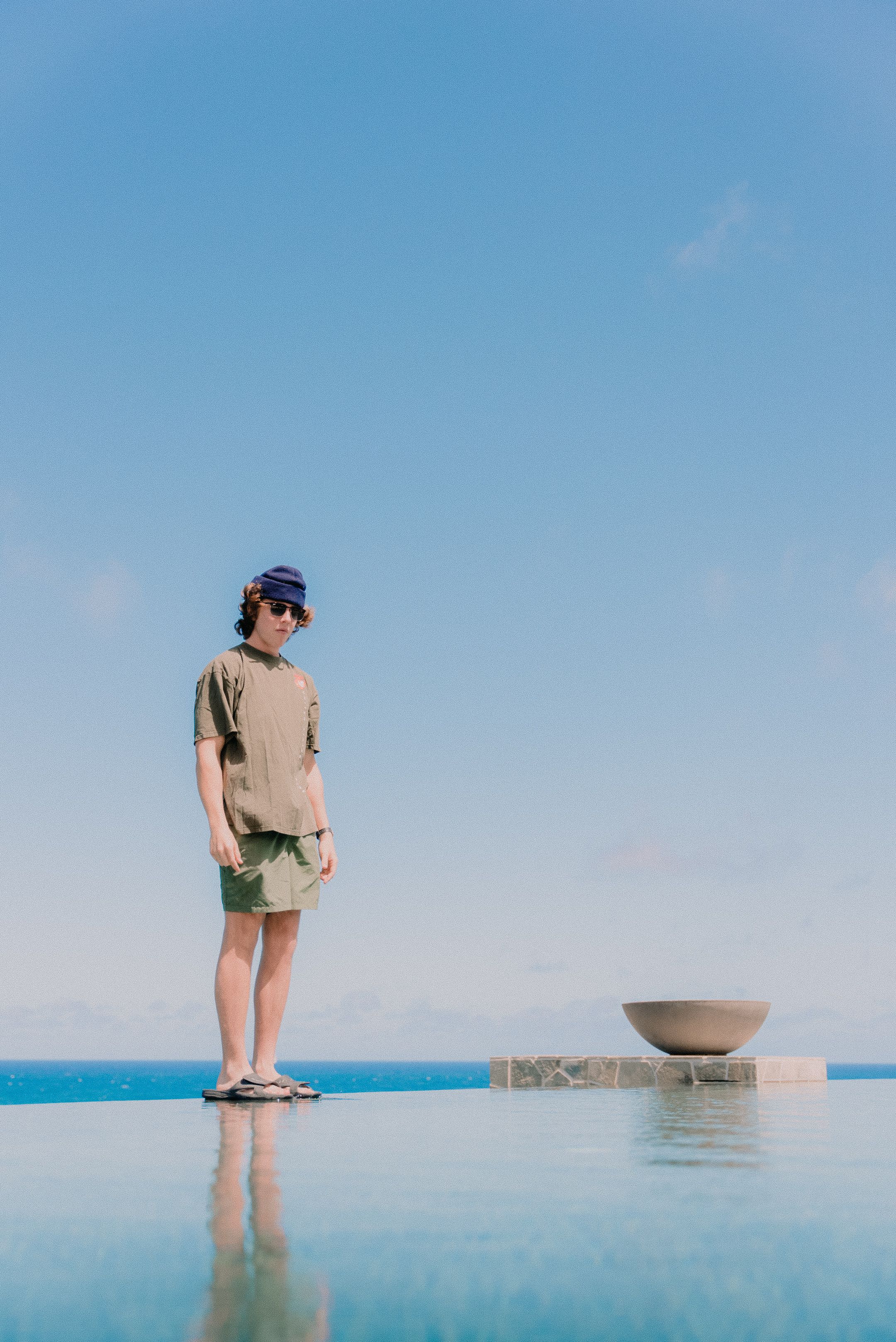 A Man Standing on the Infinity Pool · Free Stock Photo