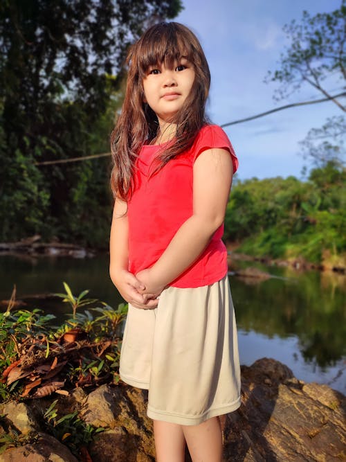 A Young Girl Wearing Red Blouse