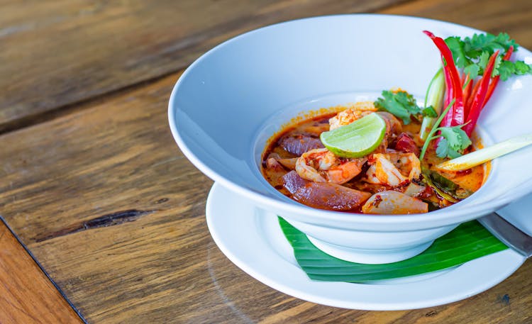 Tom Yum Soup In White Ceramic Bowl