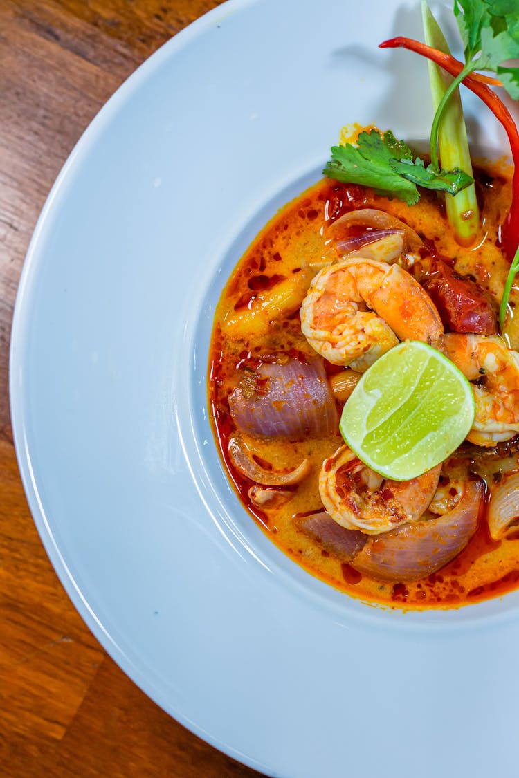 Tom Yum Soup In White Ceramic Bowl