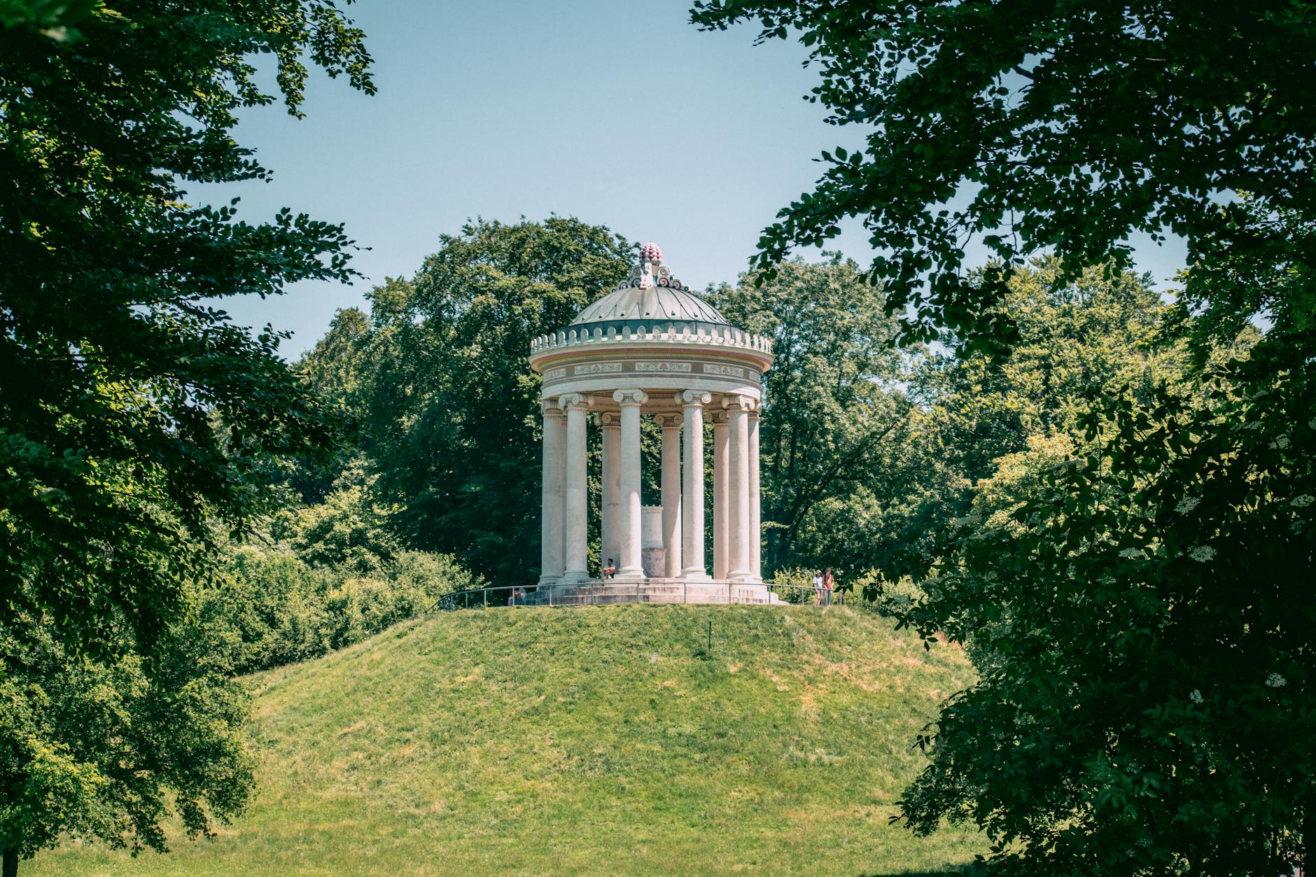 Explore the historic Monopteros hidden in Munich's lush Englischer Garten.