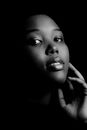 Dark Portrait of a Woman Holding Her Hand on Her Cheek 
