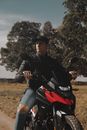 Man Sitting on a Motorbike