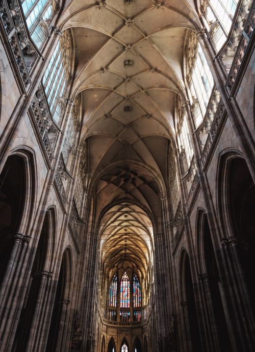 Free Explore the stunning Gothic architecture of St. Vitus Cathedral in Prague with intricate arches and stained glass windows. Stock Photo
