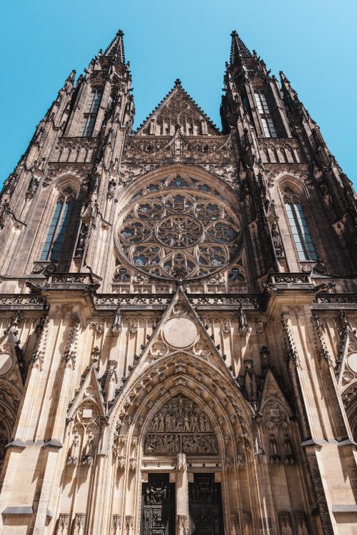 Free Stunning Gothic architecture of St. Vitus Cathedral in Prague, under a clear blue sky. Stock Photo