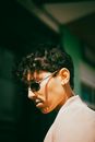 Man in White Shirt Wearing Black Sunglasses