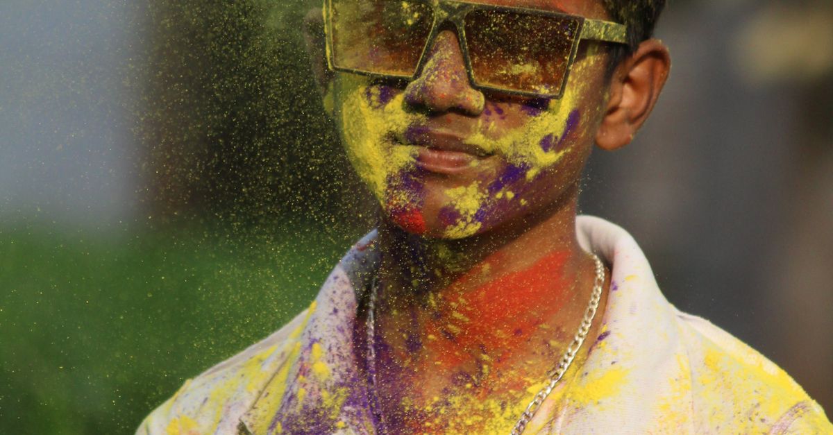 A Man with Colorful Powder on His Body · Free Stock Photo