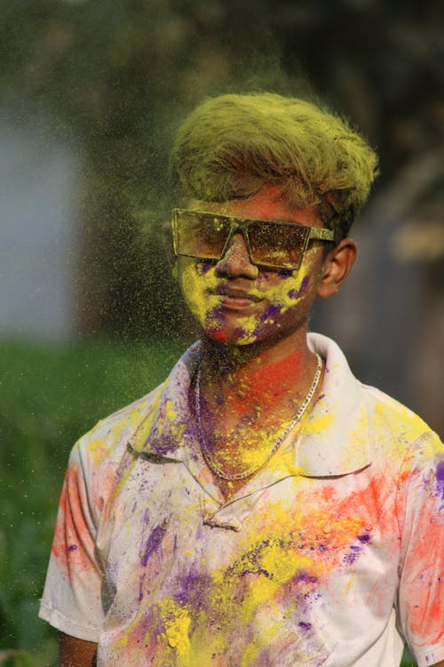 A Man with Colorful Powder on His Body