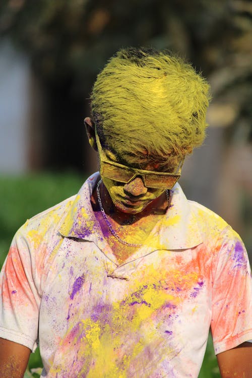 Free Close-up Shot of a Man Covered with Colorful Powder  Stock Photo