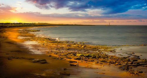 Dramatic Sky Over a Rocky Beach 