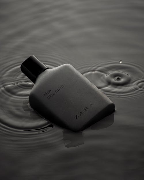 Men Perfume Bottle Floating in Water 