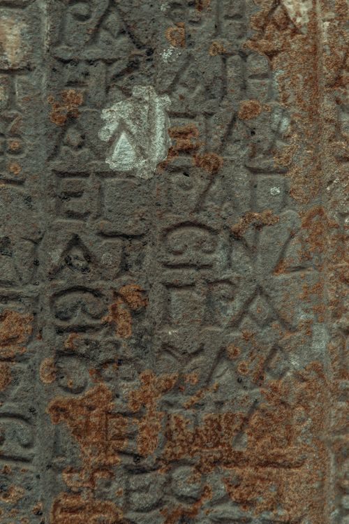 Stone Carving Script Letters Carved in Stone · Free Stock Photo