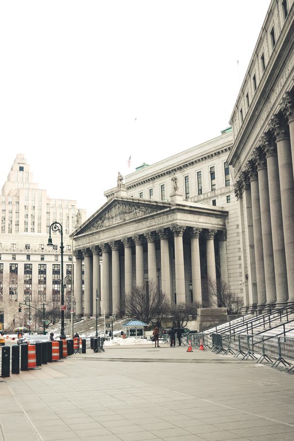 The New York County Courthouse beneath a white sky, used as an illustrative court-services photograph; this is not a Kern County courthouse.