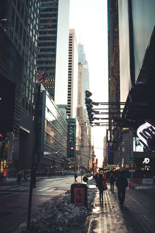 Free A bustling winter street scene in Manhattan, New York City, showcasing modern architecture and city life. Stock Photo