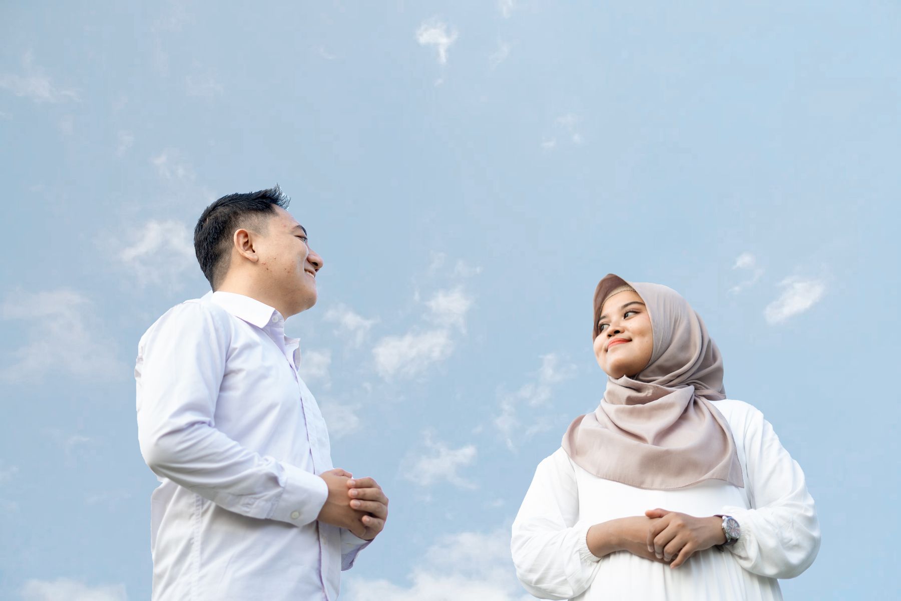 A joyful Muslim couple enjoying a peaceful outdoor moment together