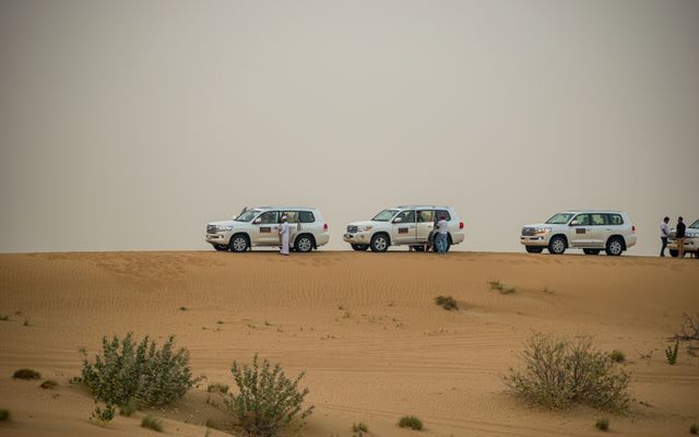 Photo: Jenis Christopher on Pexels White SUVs on a thrilling desert safari in Dubai's sandy landscape, United Arab Emirates.