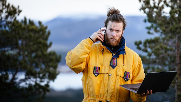 Hiker Using Technology In Mountain Area