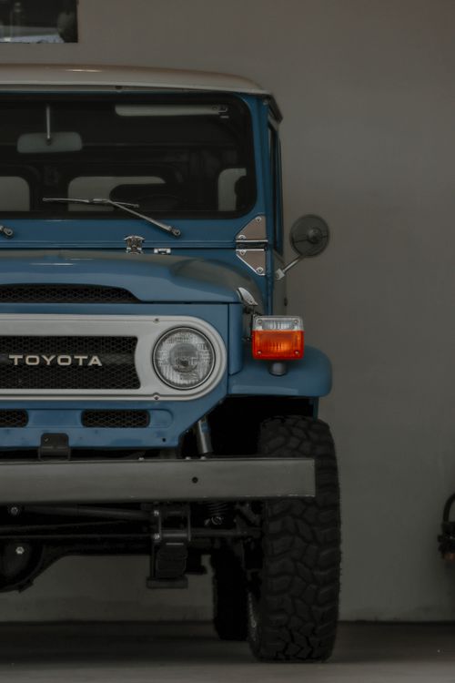 Free Close-up of a Toyota vintage off-road vehicle in a garage setting. Stock Photo