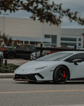 A sleek Lamborghini Huracan parked on a street in Denver, showcasing urban car culture.