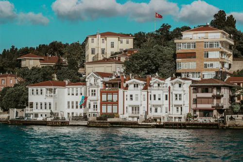 Free Charming waterfront scene showcasing traditional Turkish architecture along the Bosphorus in Istanbul. Stock Photo