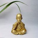 Gold Buddha Figurine on White Surface