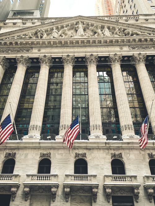 Free Neoclassical architecture with columns and American flags in New York. Stock Photo