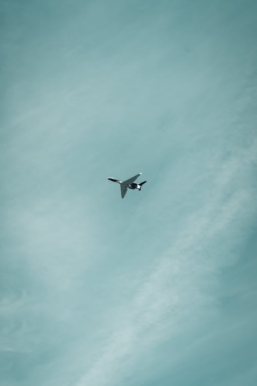 Jet Flying under a Blue Sky