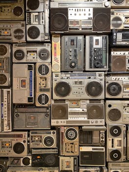 A diverse vintage boombox wall display in New Cairo, showcasing classic audio culture.