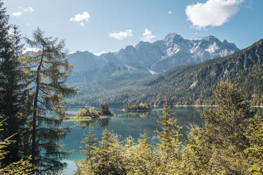 Stunning landscape of Lake Eibsee with the towering Zugspitze mountain in Bavaria, Germany.