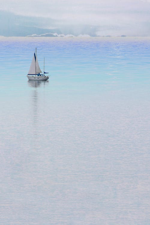 White Sail Boat on Sea