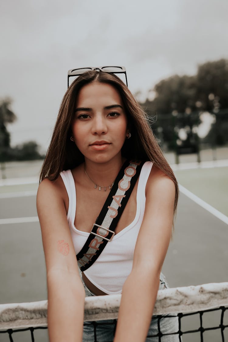 Girl With Long Brown Hair On Tennis Court