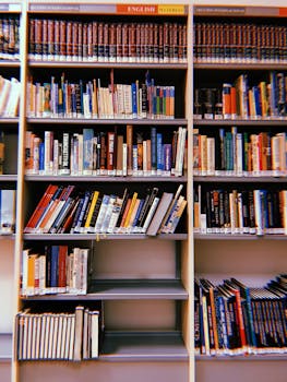 Vibrant photo of a library bookshelf in Madrid, showcasing diverse book genres and colorful covers.