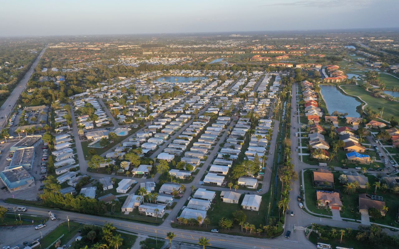 Aerial photo showcasing a suburban neighborhood in Fort Myers, Florida, with clear skies and organized streets.