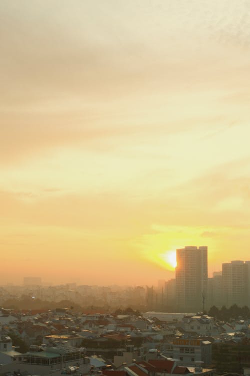 Foto profissional grátis de brilho do sol, capital, de manhã cedo