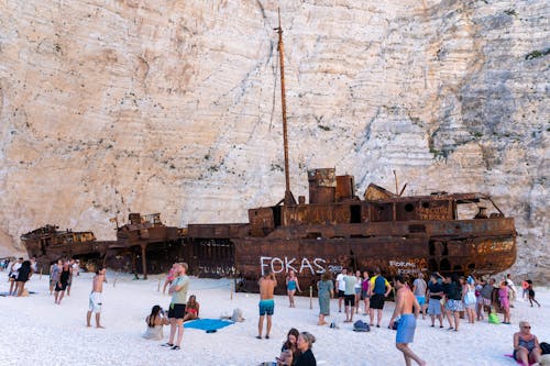 Shipwreck ]People on the Beach with a Shipwrecked