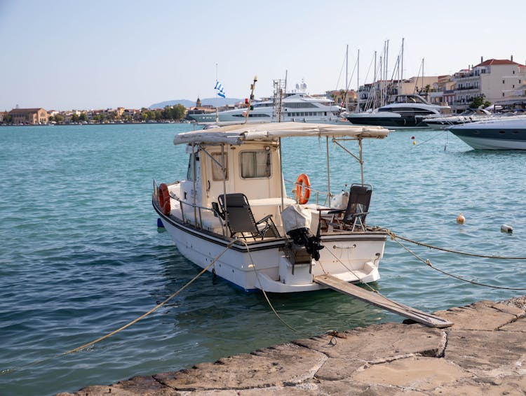 White Boat On Water In Port