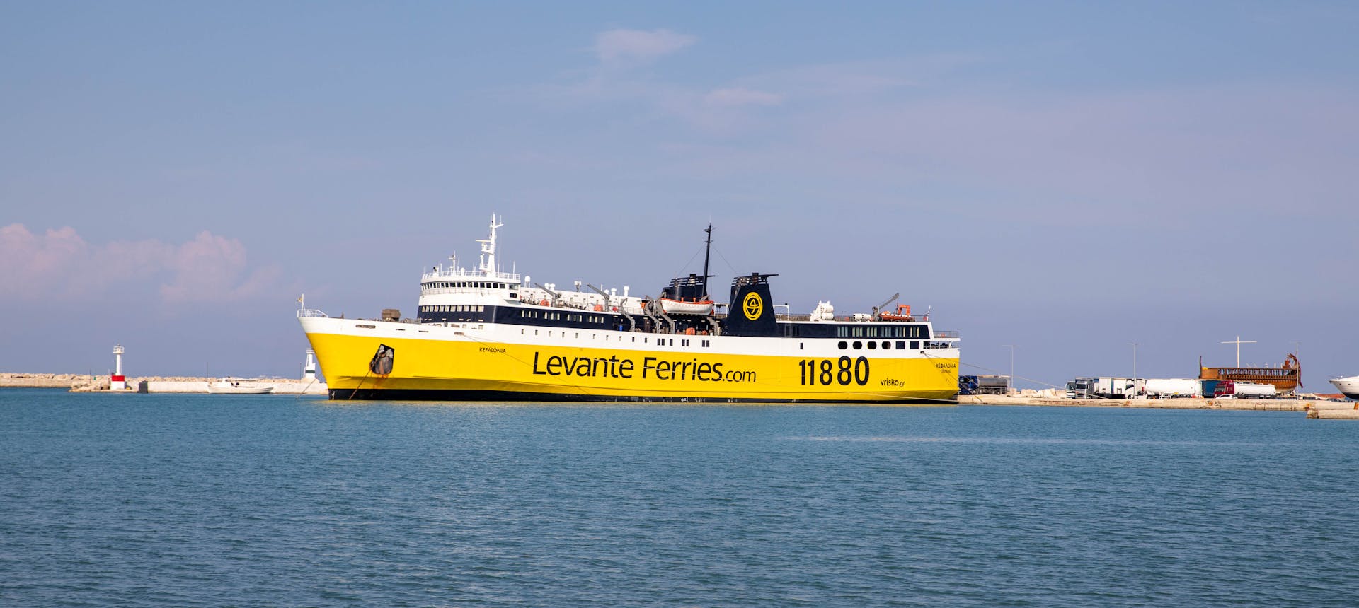 Panoramic view of Levante Ferry docked in Zakynthos Port under a clear sky.