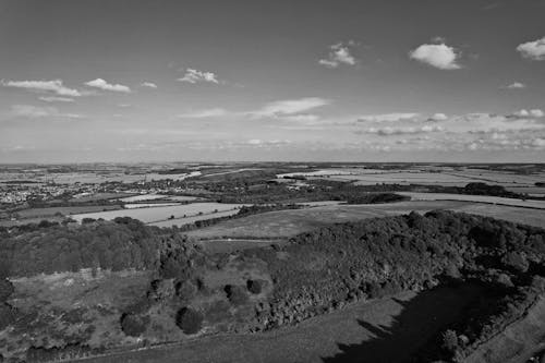 Grayscale Drone Shot of a Countryside in England