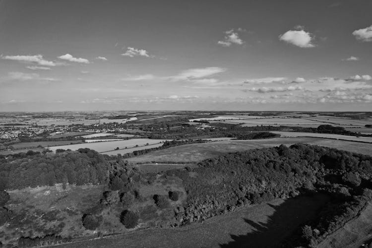 Grayscale Drone Shot Of A Countryside In England