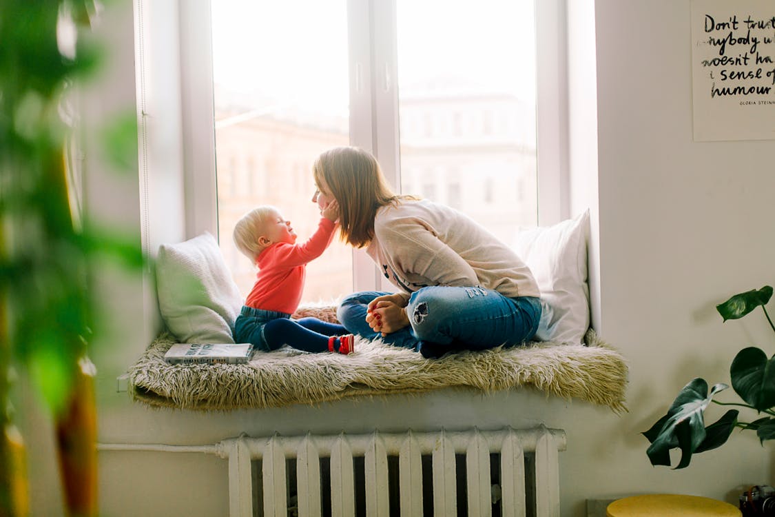 Baby Touching Woman's Face